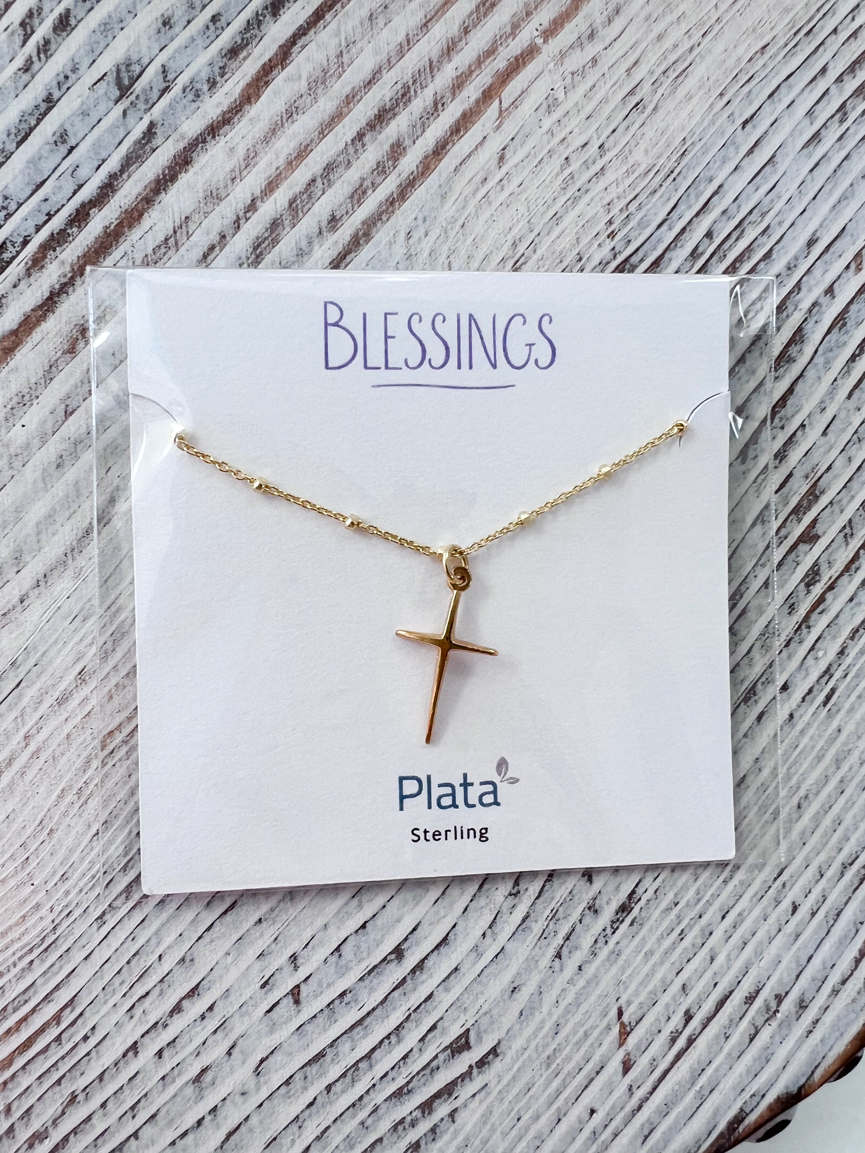 Blessings Thin Cross Necklace featuring a 20mm gold-plated thin cross pendant on a dainty textured chain with small gold balls, shown against a neutral background.
