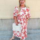 Cream midi dress with pink and orange floral print, scoop neckline, elastic waist, and flowy dolman sleeves.