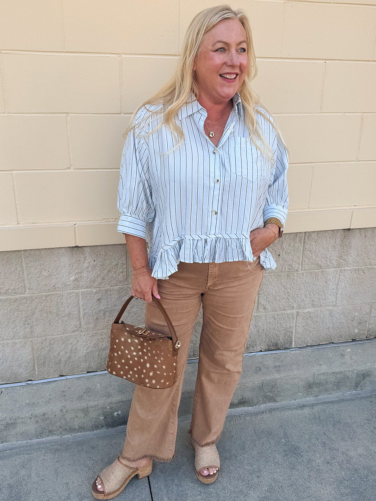 Blue Ribbon baby blue pinstripe button-down top with ruffle hem and front pocket