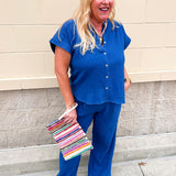 Blue textured matching top and wide-leg pants set.