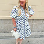 Navy floral dress with puff sleeves, button-down front, and collar