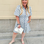 Navy floral dress with puff sleeves, button-down front, and collar