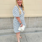 Navy floral dress with puff sleeves, button-down front, and collar