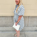 Navy floral dress with puff sleeves, button-down front, and collar