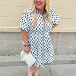 Navy floral dress with puff sleeves, button-down front, and collar