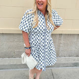 Navy floral dress with puff sleeves, button-down front, and collar