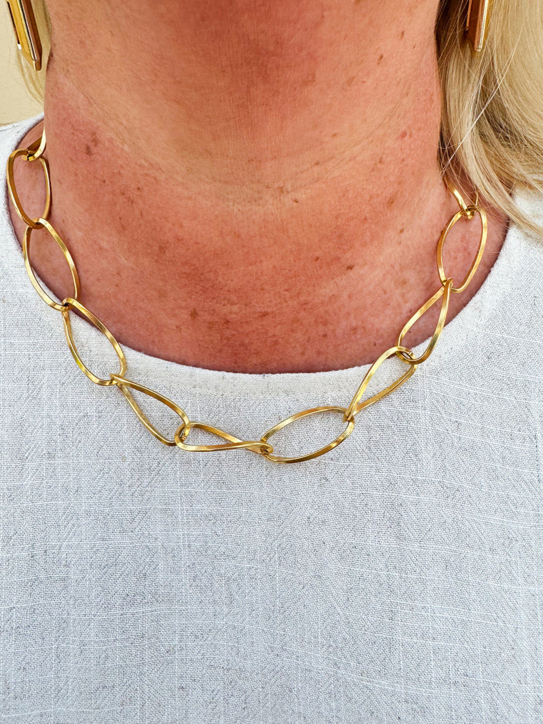 Gold chainlink necklace with large, thin links—elegant, modern, and ideal for layering.