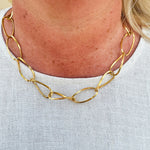 Gold chainlink necklace with large, thin links—elegant, modern, and ideal for layering.