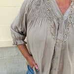 Café Season light brown long sleeve button-down blouse with ruffle collar and cuffs