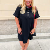 Black short sleeve A-line dress with collared neckline, three gold buttons, and knee-length silhouette.