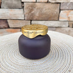 Blue Jean Terrazza Velluto petite scented candle in a decorative vessel.