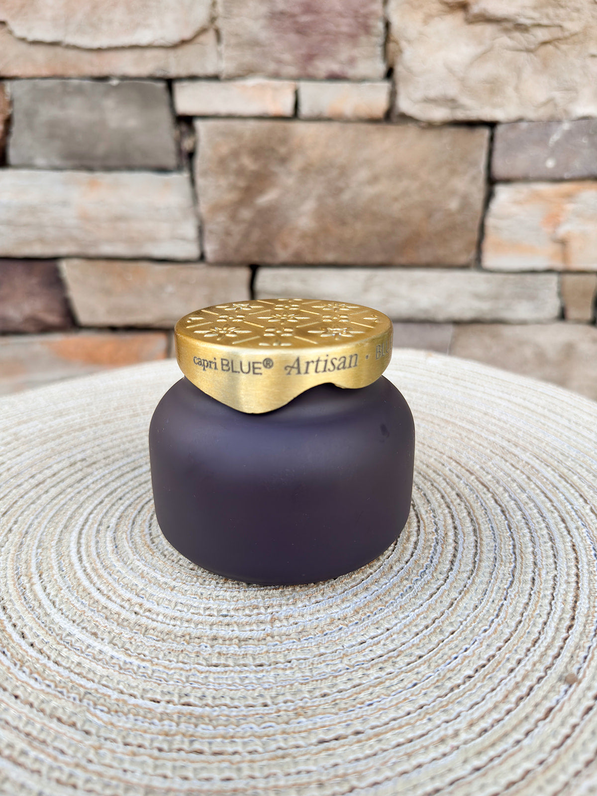 Blue Jean Terrazza Velluto petite scented candle in a decorative vessel.