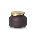 Matte mocha glass candle with a sculptural, minimalist design