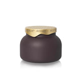 Matte mocha glass candle with a sculptural, minimalist design