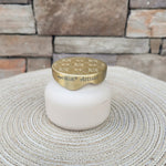 Coconut Santal Terrazza Velluto petite scented candle in a decorative vessel.