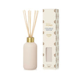 Elegant reed diffuser with luminous vessel and neutral tile-inspired design