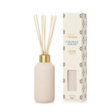 Elegant reed diffuser with luminous vessel and neutral tile-inspired design