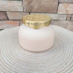 Coconut Santal Terrazza Velluto scented candle in an elegant decorative vessel.
