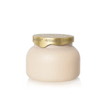 Matte porcelain candle with neutral tile-inspired carton
