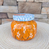 Pumpkin Dulce 19oz jar candle with festive Holiday Pattern Play design.