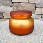 Pumpkin Dulce Tuscan Radiance scented candle in an elegant decorative vessel.