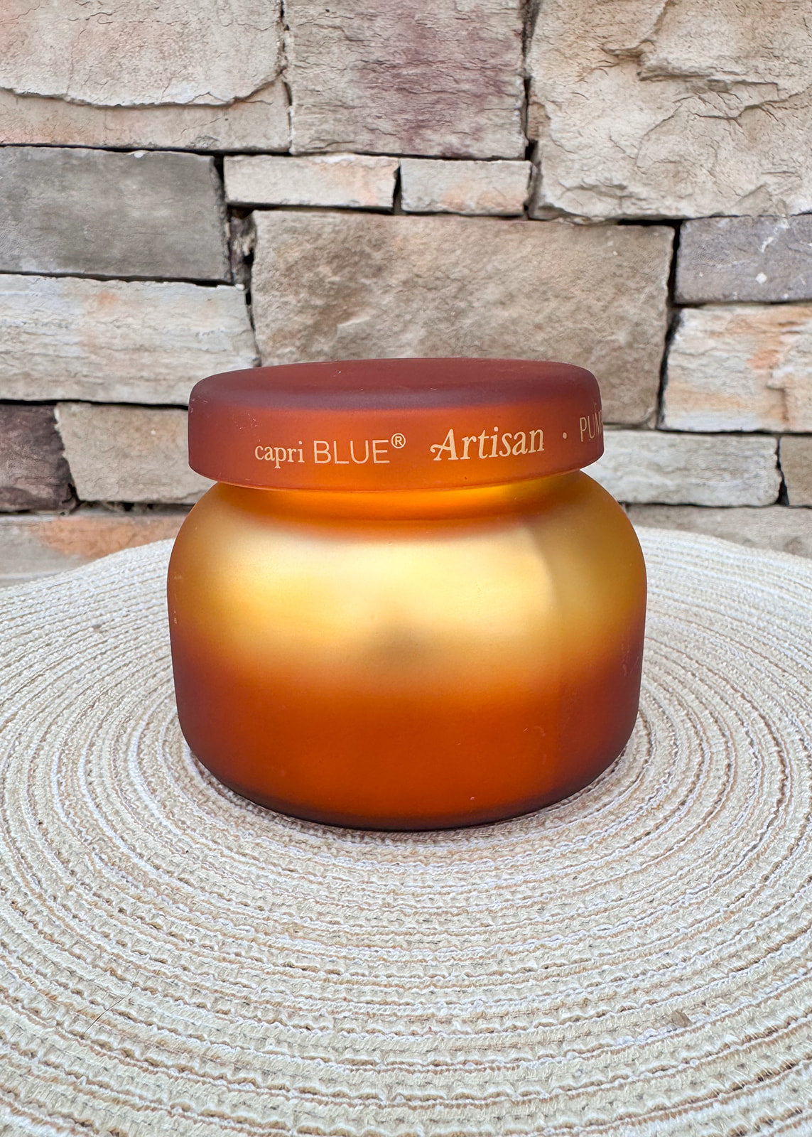 Pumpkin Dulce Tuscan Radiance scented candle in an elegant decorative vessel.
