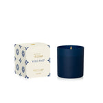 Matte midnight glass tumbler candle with neutral European tile-inspired patterned carton