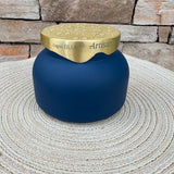 Navy blue Volcano scented candle with gold lid