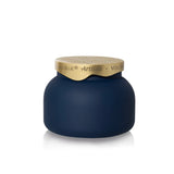 Matte midnight glass candle with sculpted brushed-gold architectural lid