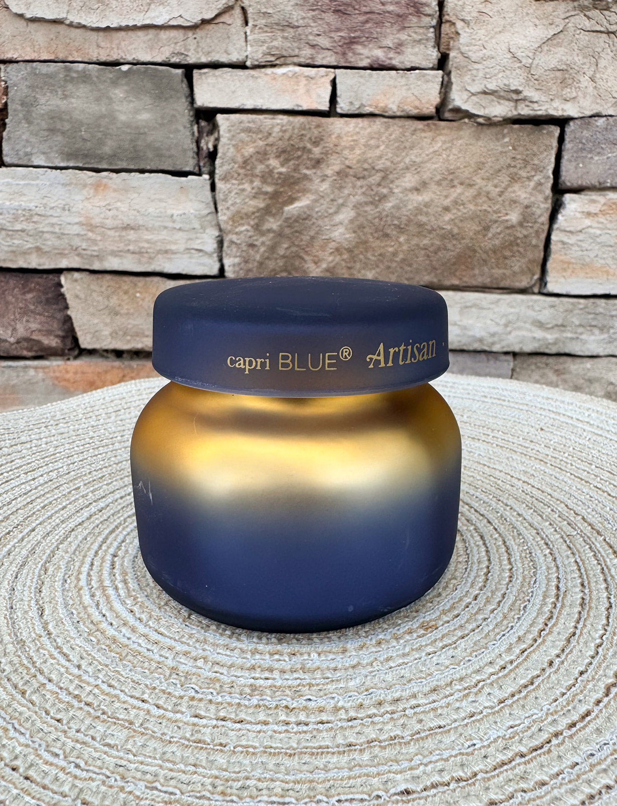 Volcano Tuscan Radiance petite scented candle in a decorative vessel.