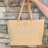Natural oversized V-quilted straw tote with vegan leather trim, zipper closure, and multiple interior pockets