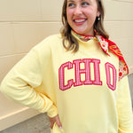 Golden yellow oversized mock neck sweatshirt with red gingham CHI O appliqué lettering across the front.
