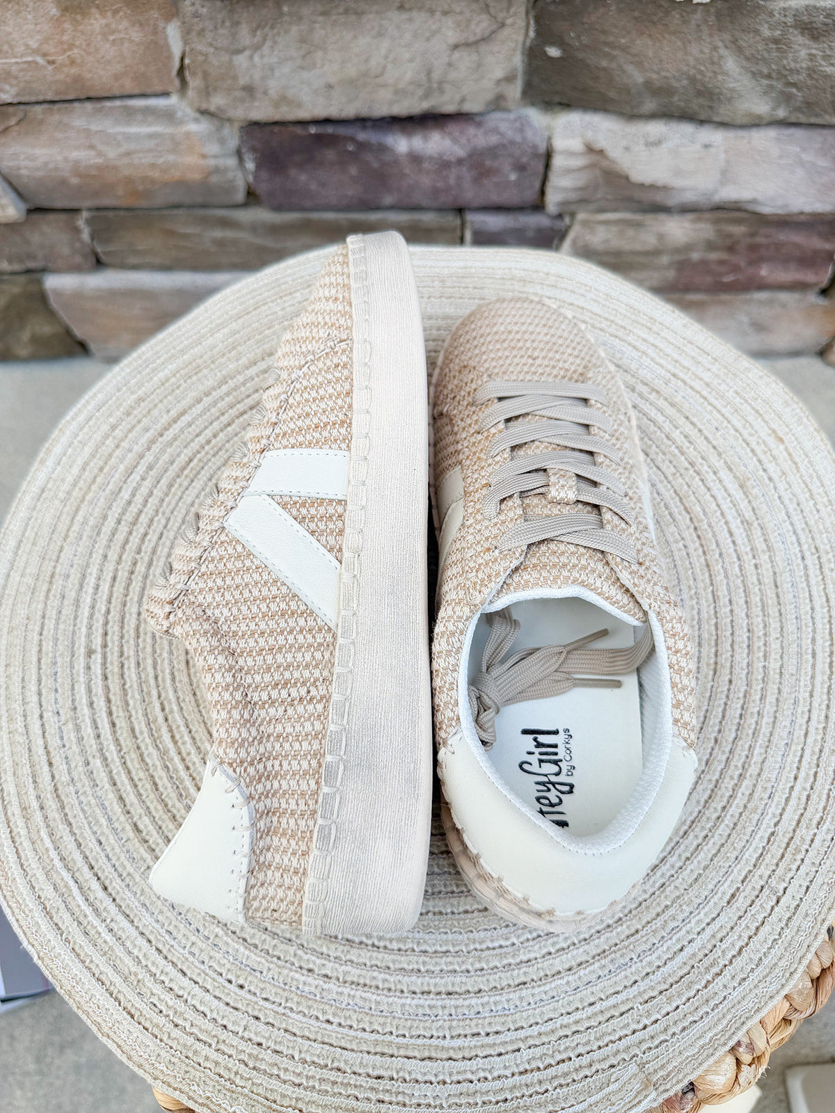 Neutral woven Corkys lace-up sneakers with side stripe detail, cushioned sole, and low-top silhouette in a versatile white combo colorway.