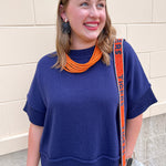 Navy half sleeve crew neck sweater top with thick stitched hems and relaxed silhouette.