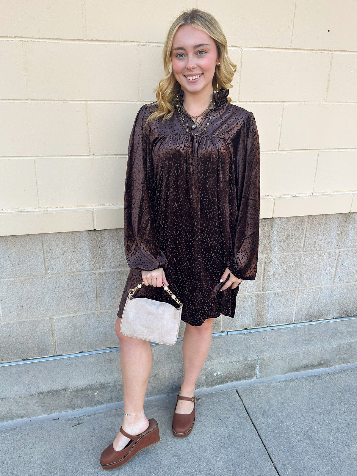 Dark brown velvet dress with V-neckline and allover raised texture