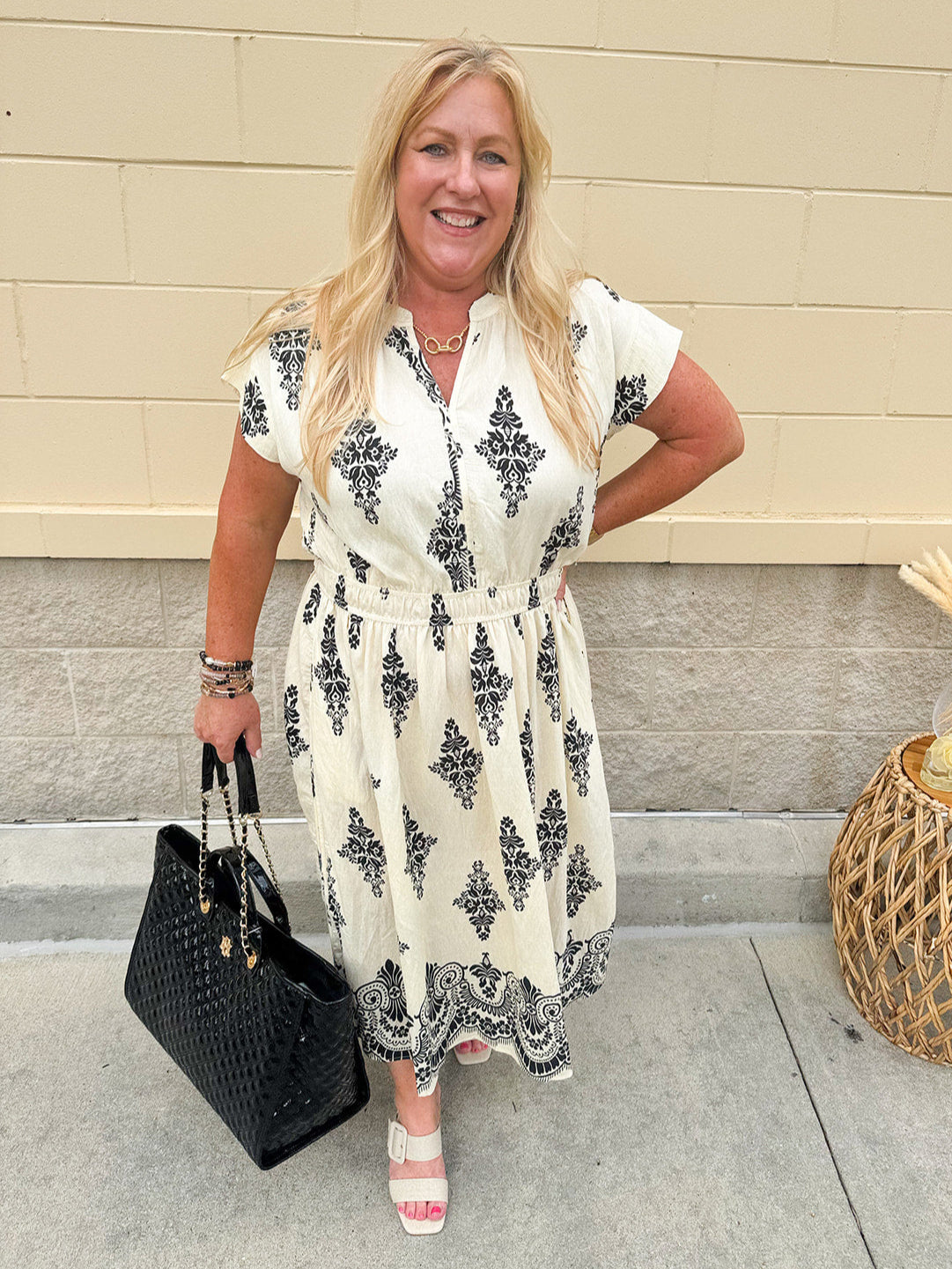 Printed V-neck midi dress with short sleeves and an elastic waistline—flattering, feminine, and perfect for year-round wear.