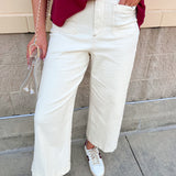 High-rise ivory cropped wide leg jeans with a clean hem and comfortable stretch denim for a polished everyday look.