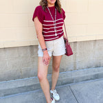 Stone high rise woven shorts with front patch pockets, clean hem, and structured silhouette.