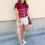 Stone high rise woven shorts with front patch pockets, clean hem, and structured silhouette.