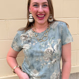 Dusty blue short sleeve top with watercolor floral pattern
