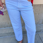 Mid-rise straight leg jeans featuring a white denim base with subtle blue vertical stripes and a clean hem.