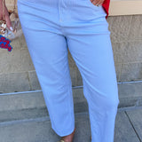 Mid-rise straight leg jeans featuring a white denim base with subtle blue vertical stripes and a clean hem.