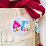 Delta Gamma Rainbow Bubble Letters Button Pin