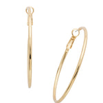 Long, slender gold hoop earrings with crystal shimmer and secure clip back closure
