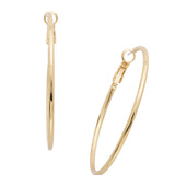 Long, slender gold hoop earrings with crystal shimmer and secure clip back closure