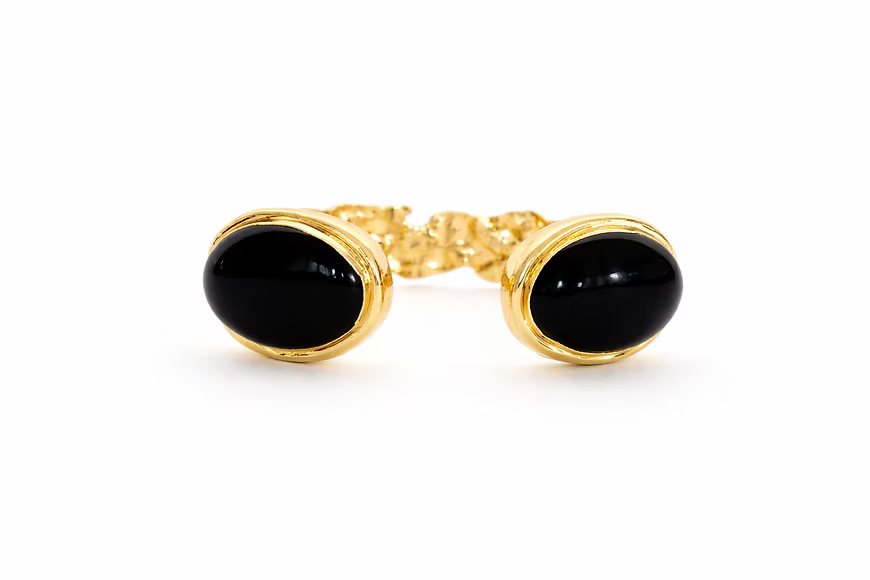 Adjustable 18K gold-plated cuff bracelet featuring black onyx semi-precious stones