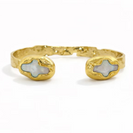 Adjustable 18K gold-plated cuff bracelet featuring luminous pearl and cross-inspired accents