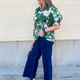  [Entro] Forest Floral Blouse featuring a cream background and dark green floral pattern.