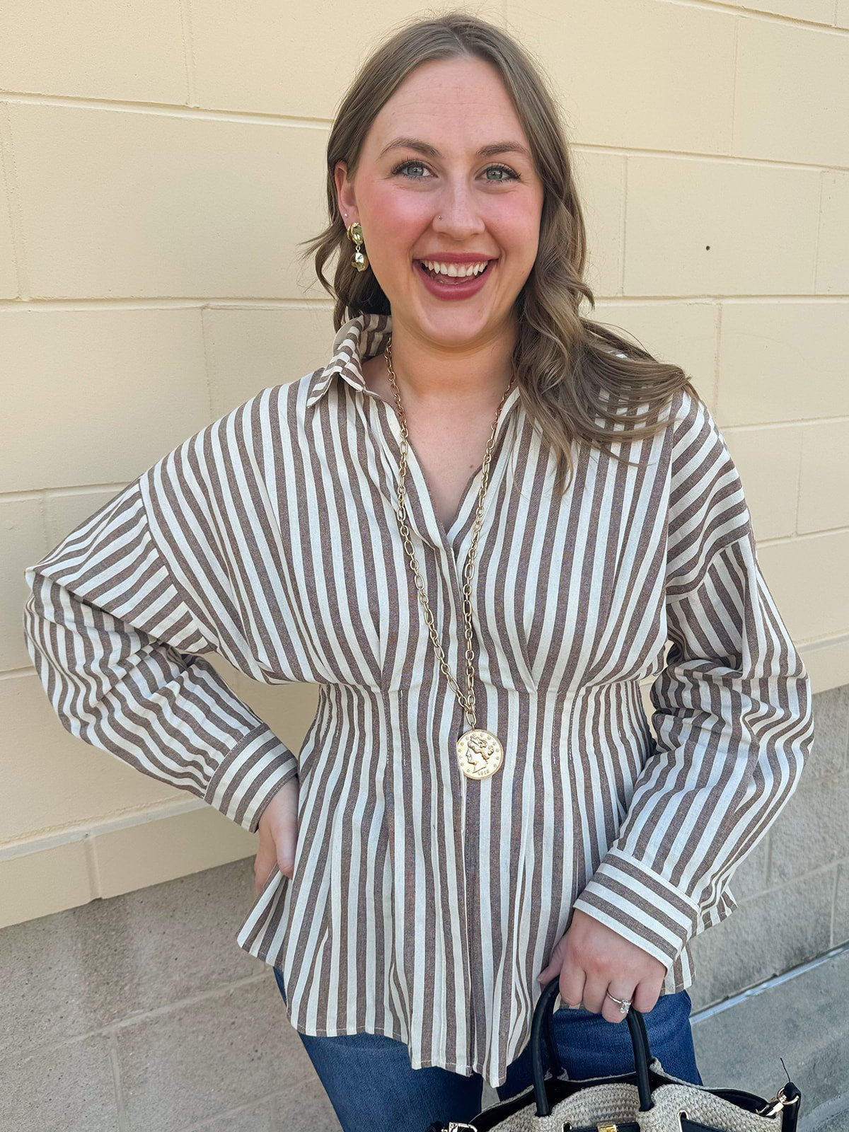Taupe brown and cream striped long sleeve blouse with collared neckline and cinched waist