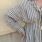 Taupe brown and cream striped long sleeve blouse with collared neckline and cinched waist